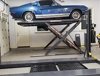 Raised Shelby on an Autostacker Parking Lift