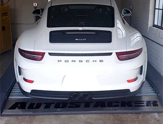 White Porsche on an Autostacker Parking Lift